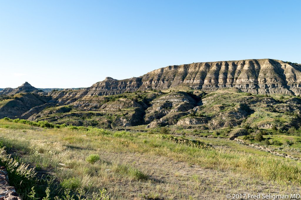 20170621_195224 D4S.jpg - Theodore Roosevelt National Park lies in western North Dakota, where the Great Plains meet the rugged Badlands. A habitat for bison, elk and prairie dogs, the sprawling park has 3 sections linked by the Little Missouri River. The park is known for the South Unit’s colorful Painted Canyon and the Maltese Cross Cabin, where President Roosevelt once lived.  The smaller North Unit is situated about 80 mi (130 km) north of the South Unit, on U.S. Highway 85, just south of Watford City, North Dakota, site of the current photo.