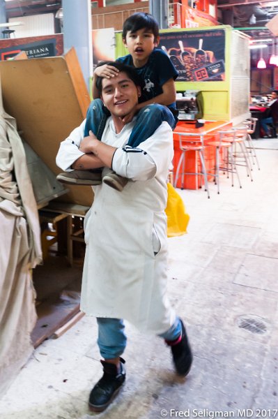 224 20170306_155138 D3S.jpg - Boy on Man's shoulders, San Juan Market