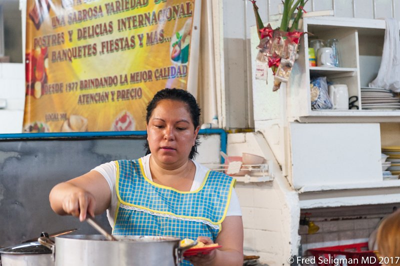231 20170306_155814 D3S.jpg - Lady preparing a plate of food, San Juan Market, Mexico City